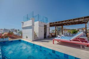 a swimming pool with a slide on a house at Casa Stella - Authentic Luxury Rooftop Pool in Cartagena de Indias