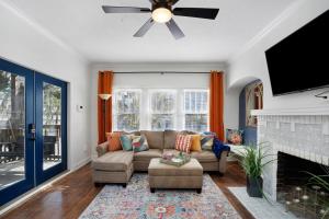 a living room with a couch and a fireplace at Cruise the waterways from your backyard in Bradenton