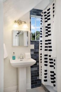 a bathroom with a sink and a mirror at Cruise the waterways from your backyard in Bradenton +44 photos