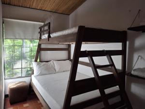 a bedroom with two bunk beds and a window at TierraViva in Tobia +40 photos