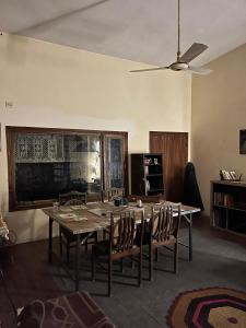 a dining room with a table and chairs at Rooms In Central Rawalpindi in Rawalpindi