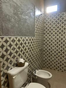 a bathroom with a toilet and a sink at Capitan de Ansilta in Calingasta