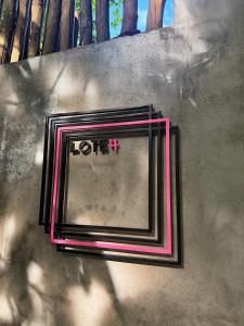 a tv sitting on the side of a wall at LOTE4 - LGBTQ Studios in Playa del Carmen +38 photos