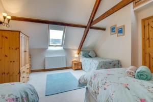 a bedroom with two twin beds and a window at 2 Bed in Exminster oc-h28725 in Exminster