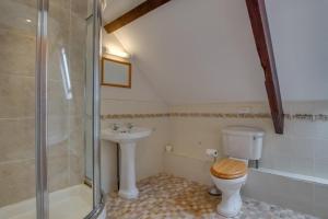 a bathroom with a toilet and a sink and a shower at 2 Bed in Exminster oc-h28725 in Exminster