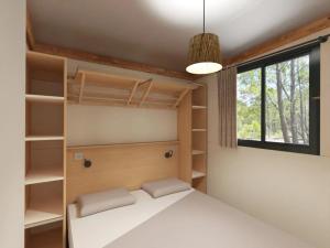 a bedroom with bunk beds and a window at Chalet 3 étoiles - Piscine - ccbbgcc in Sauxillanges +71 photos