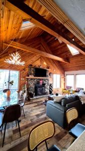 a living room with a couch and a fireplace at Guys Getaway Cabin in Ruidoso