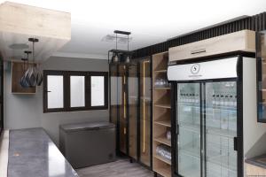 a wine shop with a glass display case at Siyamthanda Boutique in Louis Trichardt