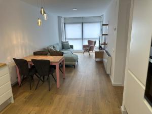 a living room with a table and a couch at 60m2 Cozy Apartament in Valencia