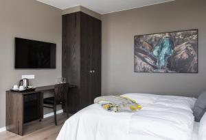 Postel nebo postele na pokoji v ubytování Hotel Ódinsvé