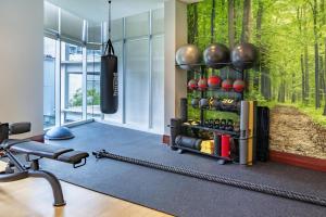 a fitness room with a gym with a fitness equipment at NH Collection Guadalajara Providencia in Guadalajara