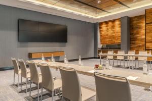 a conference room with a large table and chairs at NH Collection Guadalajara Providencia in Guadalajara