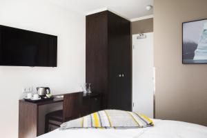 Postel nebo postele na pokoji v ubytování Hotel Ódinsvé