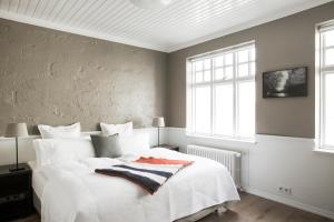 Postel nebo postele na pokoji v ubytování Hotel Ódinsvé