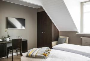 Postel nebo postele na pokoji v ubytování Hotel Ódinsvé