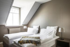 Postel nebo postele na pokoji v ubytování Hotel Ódinsvé