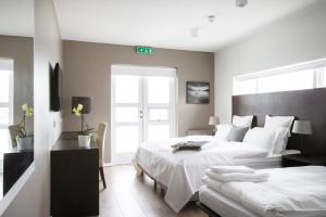 Postel nebo postele na pokoji v ubytování Hotel Ódinsvé