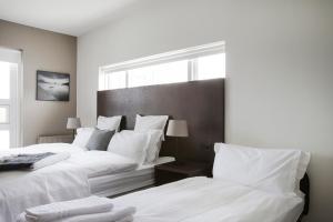Postel nebo postele na pokoji v ubytování Hotel Ódinsvé