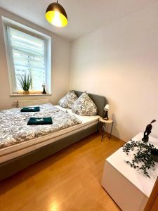 a bedroom with a bed and a window at Bright temporary apartment in Schkeuditz in Schkeuditz