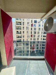 a view of a building from a window at Waterfall Studio in Bucharest