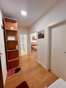 an empty room with a closet and a bedroom at Waterfall Studio in Bucharest