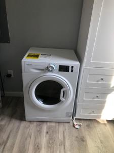 a washing machine sitting next to a white dresser at Country Hideaway For A True Getaway in Montgomery +16 photos