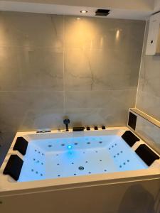 a jacuzzi bathtub in a room with at Ferienwohnung Relax - mit Whirlpool & Sauna in Medebach +35 photos