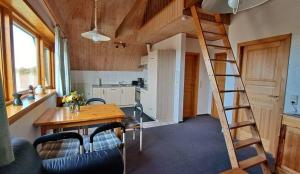 a room with a kitchen and a staircase in a house at LHMW19A14-FeWo-Seglerfruend-IV in Lemkenhafen auf Fehmarn