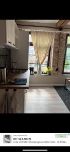 a kitchen with a sink and a window in a room at Kleine Auszeit in Oderberg +6 photos