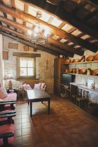 a living room with a couch and a table at Cal Terri Rural in Perafita