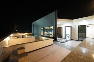 an open living room with a view of a house at Holiday Inn islamabad in Islamabad