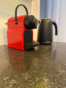 a toaster and a coffee pot on a counter at Huyze Elise Free Parking in Ostend