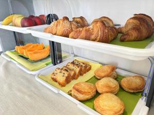 a refrigerator filled with lots of bread and pastries at B&B Dea Madre in Sarroch