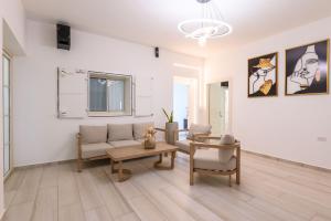 a living room with a couch and a table at Villa Alba in Majdal Shams