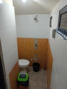a small bathroom with a toilet in a room at Cabugao guest house in El Nido +39 photos
