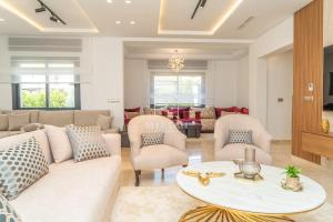 a living room with a couch and chairs and a table at Luxury Villa with Private Pool STR1 in Tangier