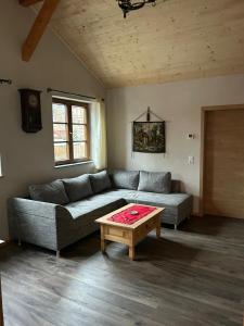 a living room with a couch and a coffee table at Insel 8 in Wernigerode