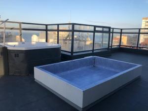 a hot tub on the roof of a building at Una perla a metros del mar in Mar del Plata
