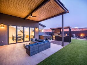 an outdoor living room with a couch and a table at Modern Luxury at Copper View Moab in Moab +27 photos