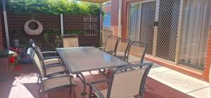 a table and chairs sitting on a patio at Annesley Central in Echuca