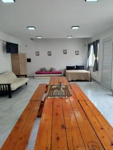 a large wooden table in a living room at Quinta la hermosa in Villa María