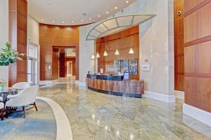 a lobby of a hotel with a reception desk at 2B Beachfront condo! Pool! Games! 15 mins to PBI! in Riviera Beach +57 photos
