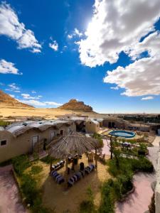 an aerial view of a building in the desert at لودج ادرار احكيك in Siwa +16 photos