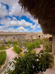 a view of a resort with a playground at لودج ادرار احكيك in Siwa
