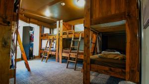 a room with two bunk beds and a hallway at Park City Hostel in Park City
