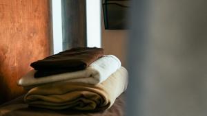 a pile of towels sitting on top of a table at Park City Hostel in Park City +28 photos