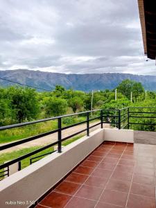 a balcony with a view of the mountains at Casa de la Sierras in Cerro de Oro