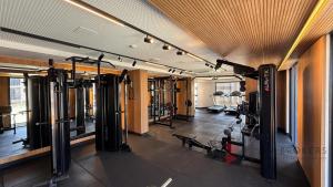 a gym with several treadmills and machines at Flat Beira Mar 331 - 424 - 426 in João Pessoa