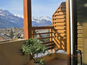 a balcony with a view of snowy mountains at Les Allobroges C03 in Guillestre