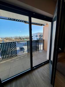 a view of a balcony with sliding glass doors at Apartament Kwiatowa in Tychy